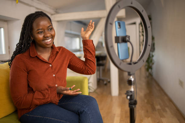 istock Smiling influencer records her podcast 1478409417