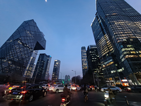 Beijing, China – March 31, 2023: Traffic jam in after-work rush hour among commercial buildings in Central Business District in the evening.