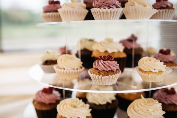 istock Tower of cupcakes with frosting and decorative sprinkles 1478410195