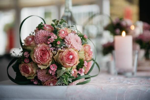 istock Romantic setting for a wedding reception is created with a display of pink roses 1478410485