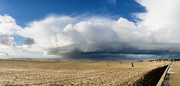 Panorama heavy weather approaching the Scheveningen beach in The Hague on a sunny day in January