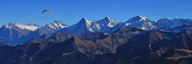Photo of Famous mountains Eiger, Monch and Jungfrau seen from Mount Niesen.