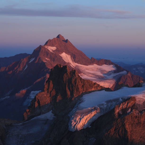 istock High mountain in purple evening light, view from mount Titlis, Switzerland. 1478410890