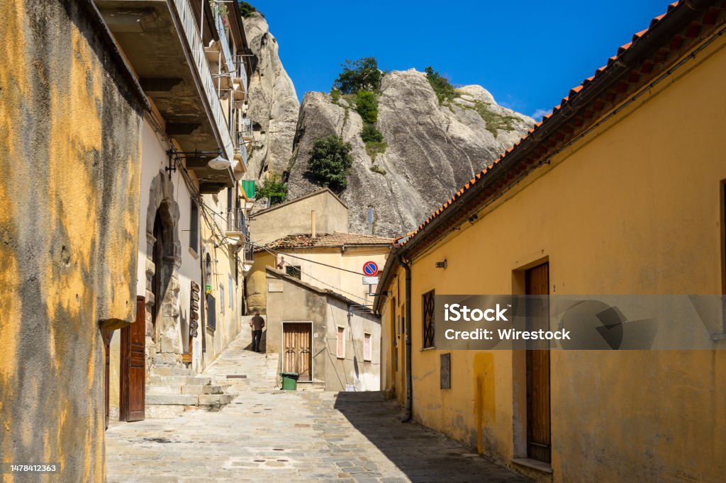 An alley in Castelmezzano, one of the most beautiful villages in An alley in Castelmezzano, one of the most beautiful villages in Basilicata region, Italy Alley Stock Photo