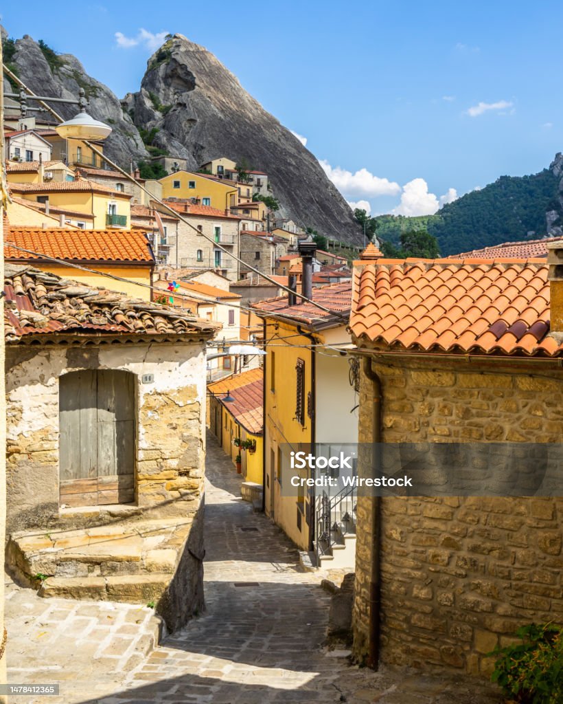 An alley in Castelmezzano, one of the most beautiful villages in An alley in Castelmezzano, one of the most beautiful villages in Basilicata region, Italy Alley Stock Photo