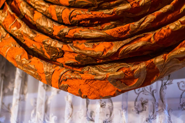 istock Luxurious curtain hanging by a window 1478413373