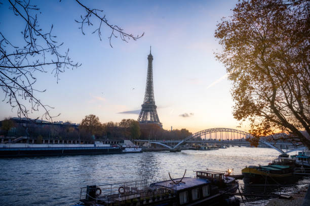 istock eiffel tower at seine river at sunset 1478413999