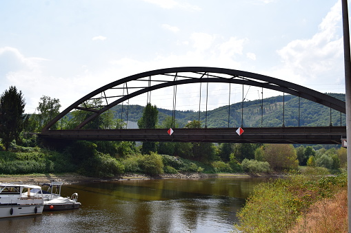 Lahnstein, Germany - 07/25/2022: dark railroad bridge across the Lahn