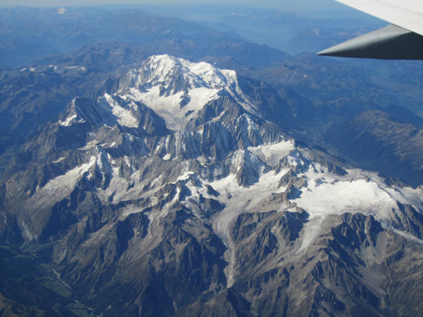 A Flight over the Alps. Passing Mont Blanc, the highest mountain in the Alps. Border mark between Italy, Switzerland and France. 09/2011.
