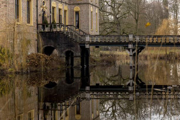 Vord, Netherlands – January 08, 2021: Detail and focus on wooden access bridge leading to the historic moated castle Vorden