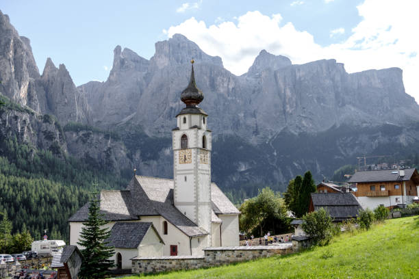 istock Corvara - August: Church St. Vigilius in Colfosco, Dolomites, Italy 1478415957