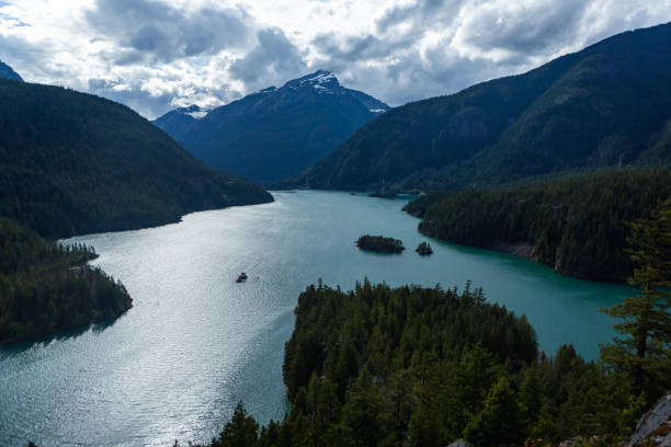 istock High angle shot of a river between hills and forests on a cloudy day 1478416705