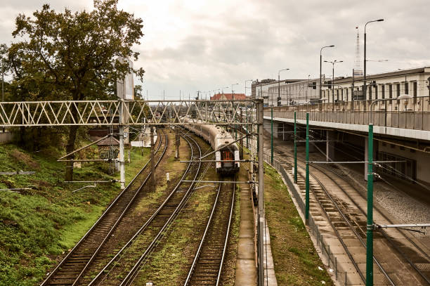 Poznan, Poland – October 12, 2017: Old tracks with moving train in the city center