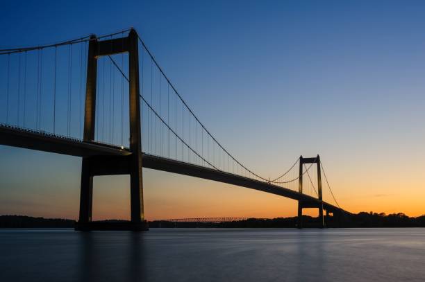 istock the large bridge spanning over water on a sunny day with sky in background 1478418205