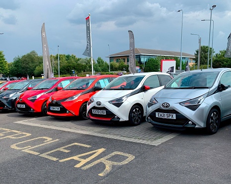 Chelmsford, United Kingdom – August 15, 2022: Second hand Toyota vehicles for sale on the forecourt of a car dealer in Chelmsford, Essex, UK.