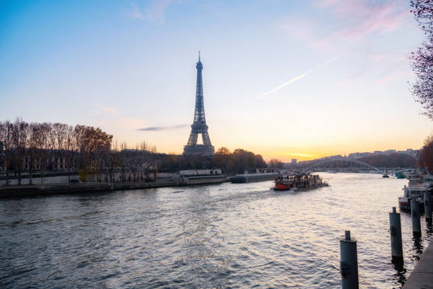 istock eiffel tower at seine river at sunset 1478420077