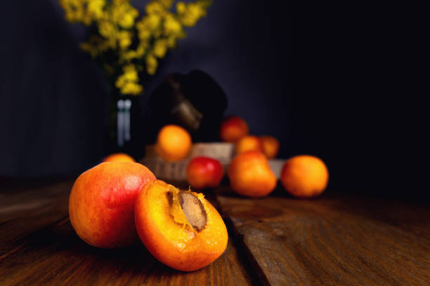 istock Selective focus shot of fresh apricots on a wooden table 1478422770