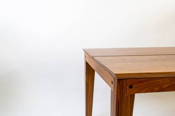 istock Detail of a rectangular wooden table isolated in a white setting 1478422920