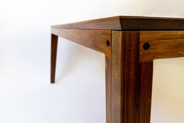 istock Detail of a rectangular wooden table isolated in a white setting 1478422943