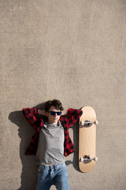 istock Top view of skater relaxing on floor 1478424132