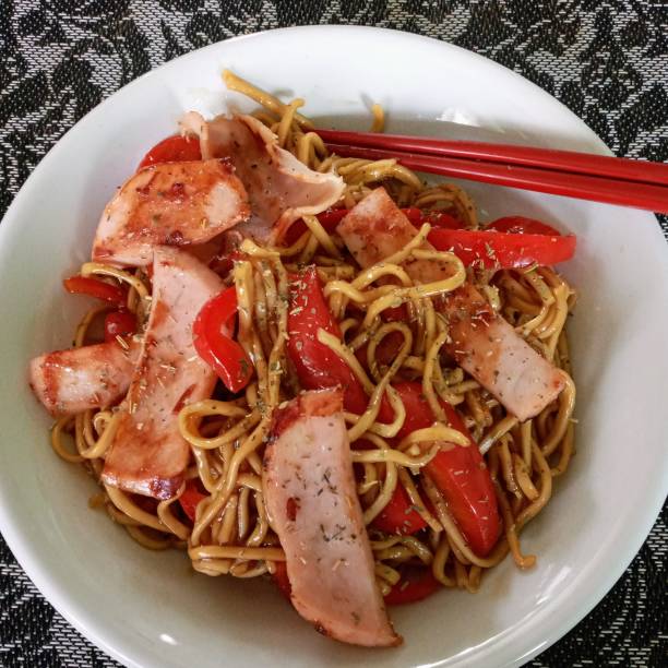 istock Chicken pieces, egg noodles with bell peppers. 1478425299