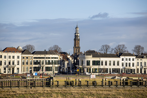 Zutphen, Netherlands – January 09, 2021: Wijnhuis tower at the central square in the background rising above the countenance city view of Hanseatic town in Gelderland province