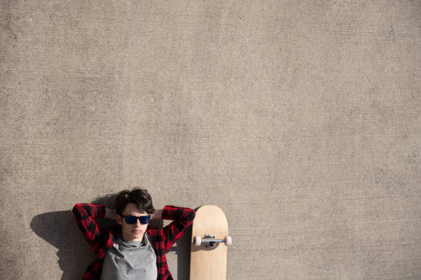 istock Teenager relaxing on concrete background 1478425755
