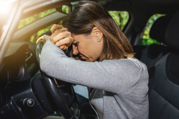 istock Caucasian female driver having a headache during driving 1478428855