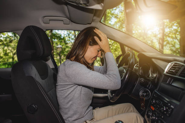 istock Caucasian female driver having a headache during driving 1478428861