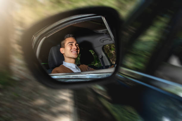 istock Latin man happily smiling and driving a car 1478428948