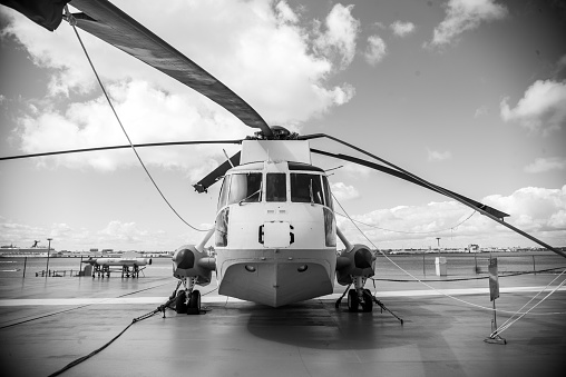 Charleston, United States – October 22, 2022: A grayscale shot of a helicopter on the USS Yorktown