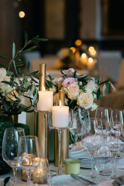 istock Elegant, dining table adorned with white floral arrangements, prefect for a wedding 1478432627