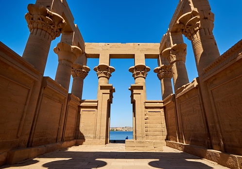 A scenic shot of the Philae temple complex against the blue sky in Egypt