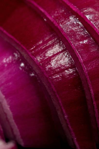 Vertical closeup shot of fresh sliced red onions