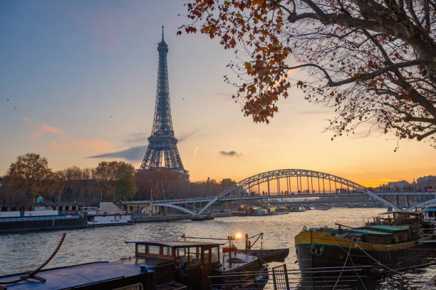 istock eiffel tower at seine river at sunset 1478433839