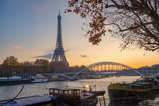 wide view on eiffel tower at seine river at blue hour