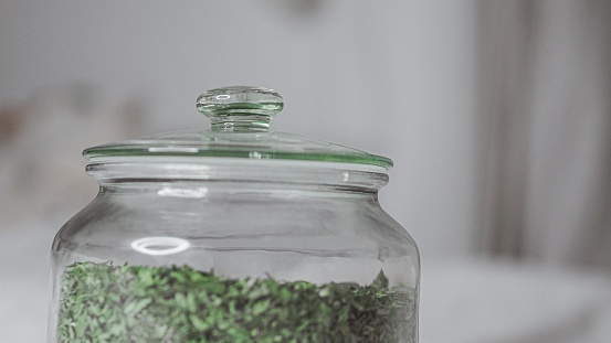 A closeup of a jar of the green tea