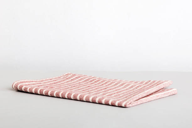 istock top view with red empty kitchen napkin isolated on table background. Folded cloth for mockup with copy space, Flat lay. Minimal style 1478437077
