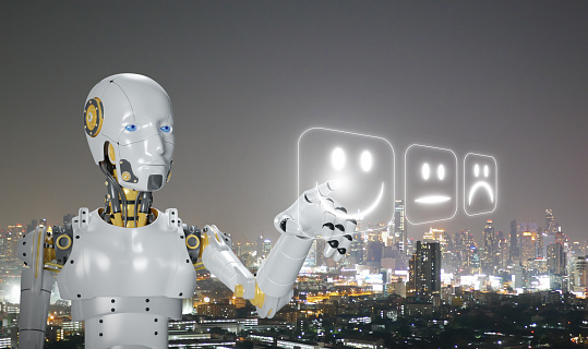 A smiling AI robot becomes sentient and conscious. Artificial, machine, or synthetic consciousness. Ai's hand points at its current mood with a night city view in the background. Technology and Science