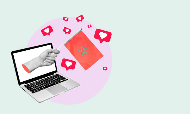 istock Art collage, the hand with a Moroccan flag from a notebook with hearts and barbs on a light background. 1478438032