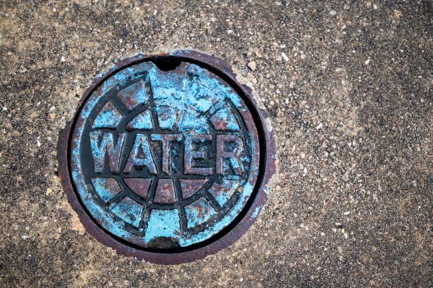 istock Top view of a sewer top with water written on it 1478439236
