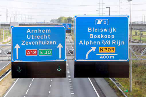 Blue signpost on the highway Blue signpost on the highway A12 to N09 Zoetermeer, Boskoop and Alphen aan den Rijn