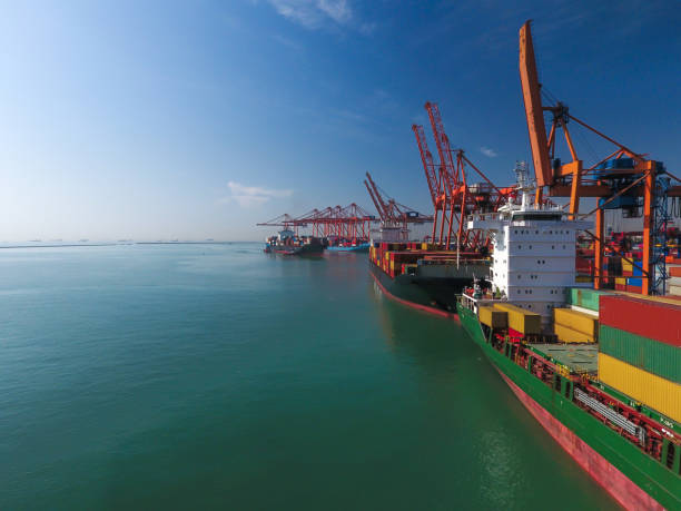 istock Aerial view cargo ship in port at container terminal port. 1478445490