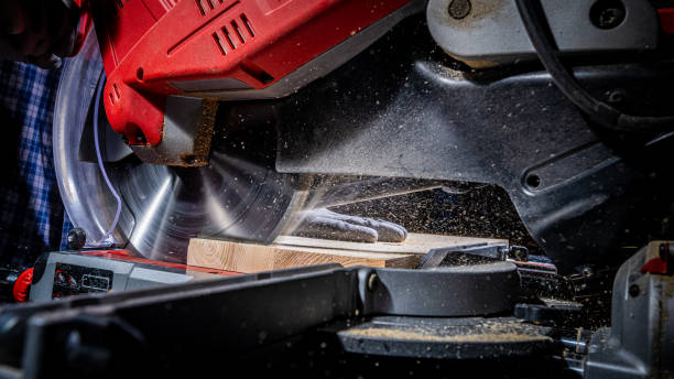 istock Cutting wooden plank with saw 1478446262