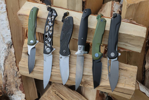 istock folding knives on birch wood close-up 1478446929