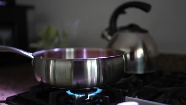 Tomato sauce being cooked on a saucepan at home