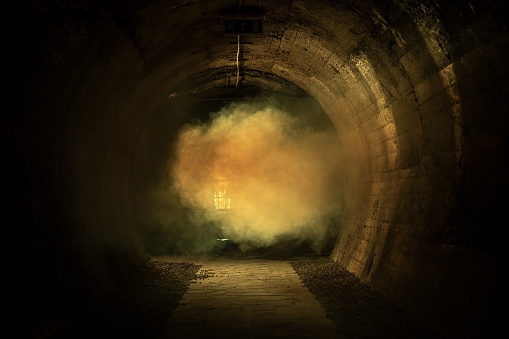 Dark tunnel with fog