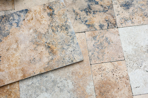 Travertine stone tiles on a patio.