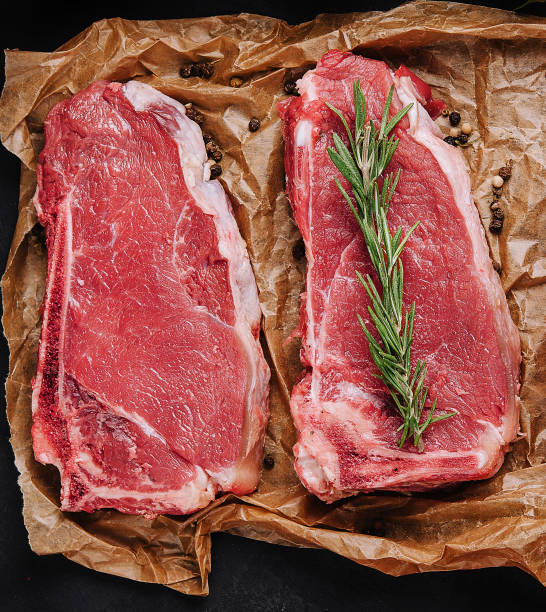 istock Raw strip loin steaks on baking paper 1478461099