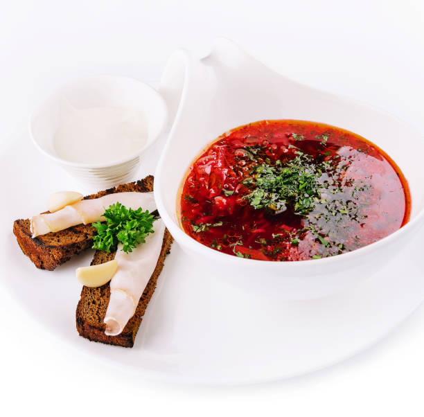 istock Appetizing dish borscht served with bread, lard slicrs and sour cream 1478461979